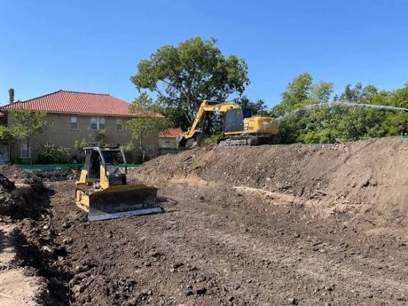 Excavation equipment completing land clearing in the Tallahassee area